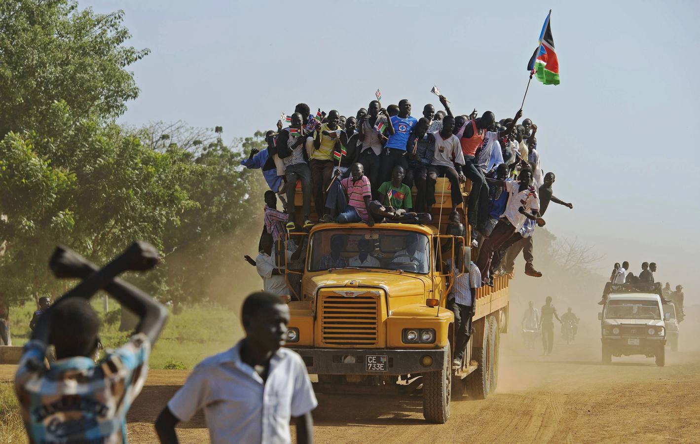 Some Sudanese on top of a vehicle for once, instead of hidden underneath it.