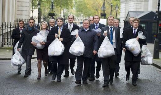 Daily Express editor Hugh Whitlow delivers a petition against the invasion to Downing Street