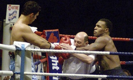 tyson ignoring the refferee to punch through him tyson ignoring the refferee to punch through him