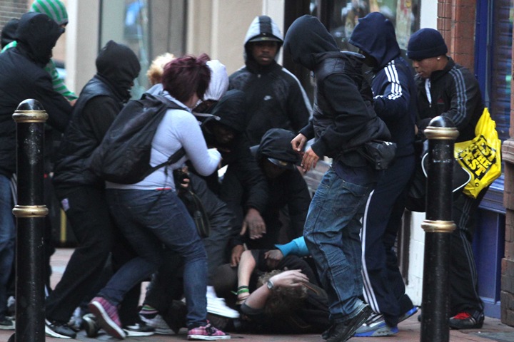 BIRMINGHAM, UNITED KINGDOM - AUGUST 8: Photographer Harry Smith is beaten and mugged. Riots have begun in Birmingham city centre, August 8, 2011. Shop fronts have been smashed and there are reports of looting. One photographer, Harry Smith, was beaten up and had his wallet and camera stolen. It follows rioting in London over the weekend. (Photo by Mathew Growcoot/newsteam) BIRMINGHAM, UNITED KINGDOM - AUGUST 8: Photographer Harry Smith is beaten and mugged. Riots have begun in Birmingham city centre, August 8, 2011. Shop fronts have been smashed and there are reports of looting. One photographer, Harry Smith, was beaten up and had his wallet and camera stolen. It follows rioting in London over the weekend. (Photo by Mathew Growcoot/newsteam)