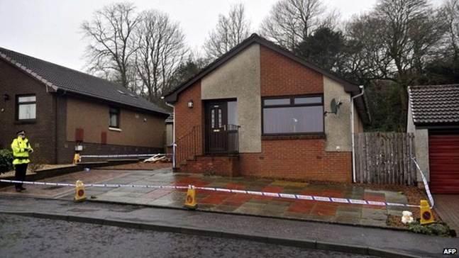 A house in Kirkcaldy was searched by police officers after Mikaeel's body was found in a wooded area behind it