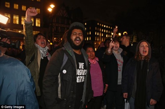 Demonstrators yelling abuse outside The Royal Courts of Justice in London
