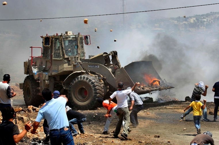 Israeli bulldozer of peace being attacked by rock-throwing terrorists.