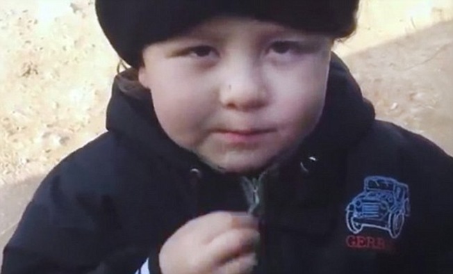 The boy will have lived almost his whole life through the Syrian conflict, though with his high voice and chubby cheeks, he belongs more in infants' school than on a battlefield The boy will have lived almost his whole life through the Syrian conflict, though with his high voice and chubby cheeks, he belongs more in infants' school than on a battlefield