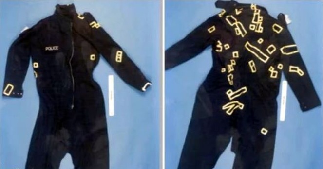 1The front and back of Blakelock's protective overalls. Each piece of tape represents a stabbing or cutting wound 1The front and back of Blakelock's protective overalls. Each piece of tape represents a stabbing or cutting wound