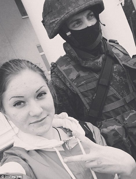 Girl snaps selfie with soldier at the Liberation of Crimea.
