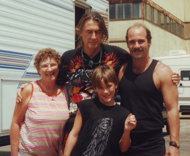 Novice actor Brad Renfro strikes a pose on location for “The Client” with, from left, grandmother Joanne Renfro, director Joel Schumacher and father Mark Renfro.