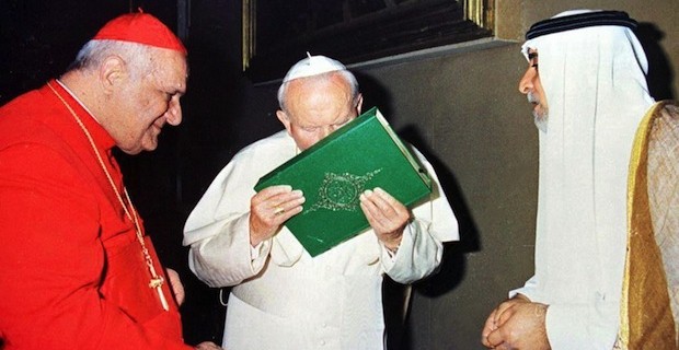 The "pope" kissing the Koran.