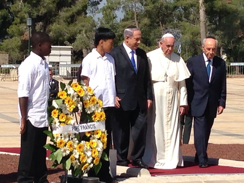 Francis with his Jewish masters at Herzl Cemetery.