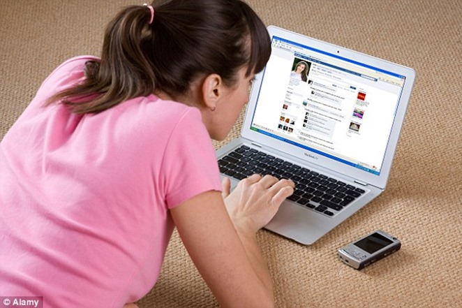 1407977541228_wps_1_A_young_woman_looking_at_ 1407977541228_wps_1_A_young_woman_looking_at_