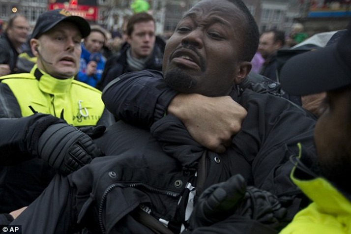 1416073857136_wps_3_Police_detain_an_anti_Bla