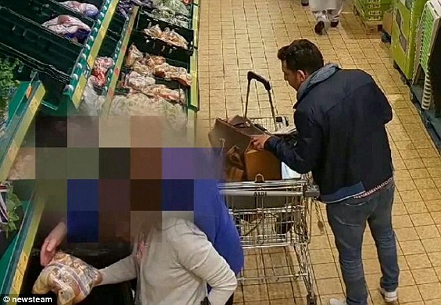 While the scuzzy female distracts the pensioner (front left), her filthy male accomplice raids her handbag for her purse.