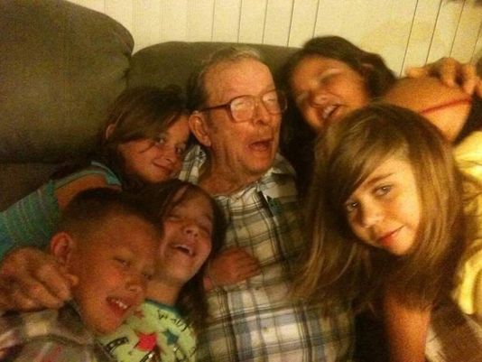 Henry Sawyer surrounded by some of his great grandchildren on Father's Day.