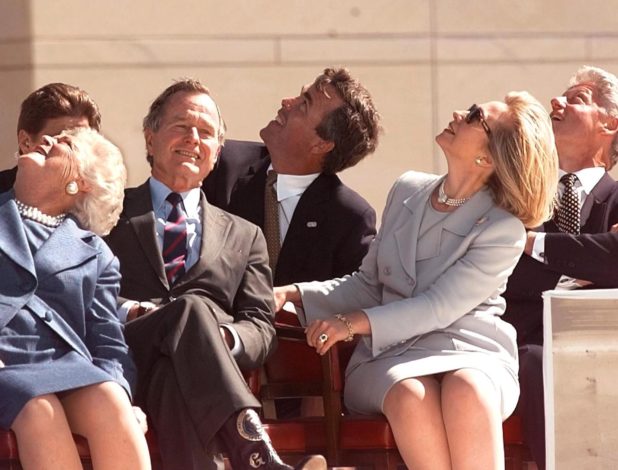 COLLEGE STATION, UNITED STATES: Former US president George Bush (2nd-L), his wife Barbara Bush (L), their son Jeb Bush (C), First Lady Hillary Clinton (2nd-R), and US President Bill Clinton (R) look up to see the US Army Golden Knights parachute team 06 November at the conclusion of the dedication ceremony of the George Bush Library in College Station, TX. The current and former presidents of the US and a host of former world leaders and policy makers attended the 06 November dedication of the library. (ELECTRONIC IMAGE) AFP PHOTO Joyce NALTCHAYAN (Photo credit should read JOYCE NALTCHAYAN/AFP/Getty Images)