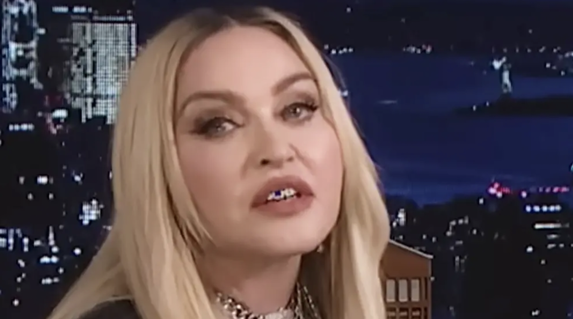 Satanic Mutant Freak Madonna Says Her Pet Negro Sex Toy Wears Her Clothes Better Than She Does