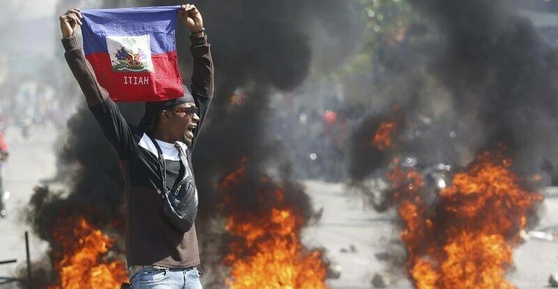 Haiti: Armed Gangs Raid Country’s Biggest Prison, Spring Thousands of Prisoners