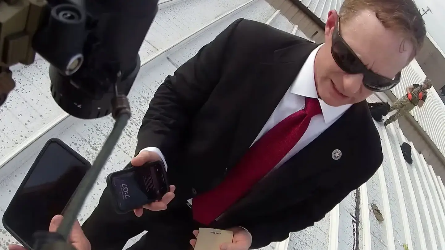 Watch: New Video Shows Body of Alleged Trump Ear Scratcher on the Roof